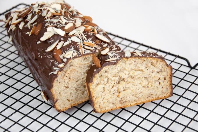 Vegan Almond Cake with chocolate coating and sliced almonds