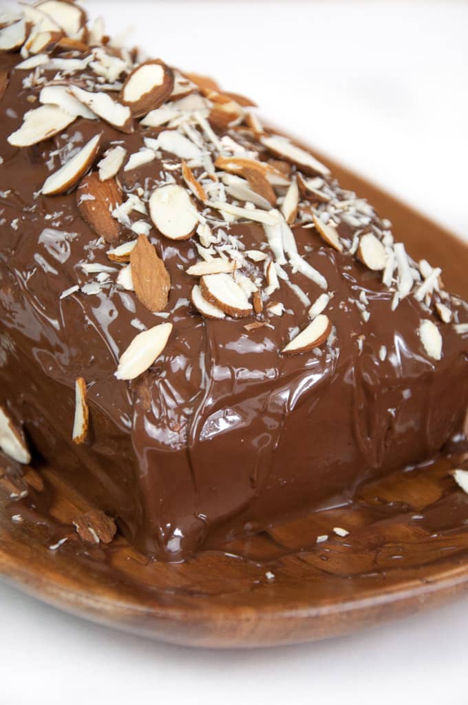 Vegan Almond Cake with chocolate coating and sliced almonds