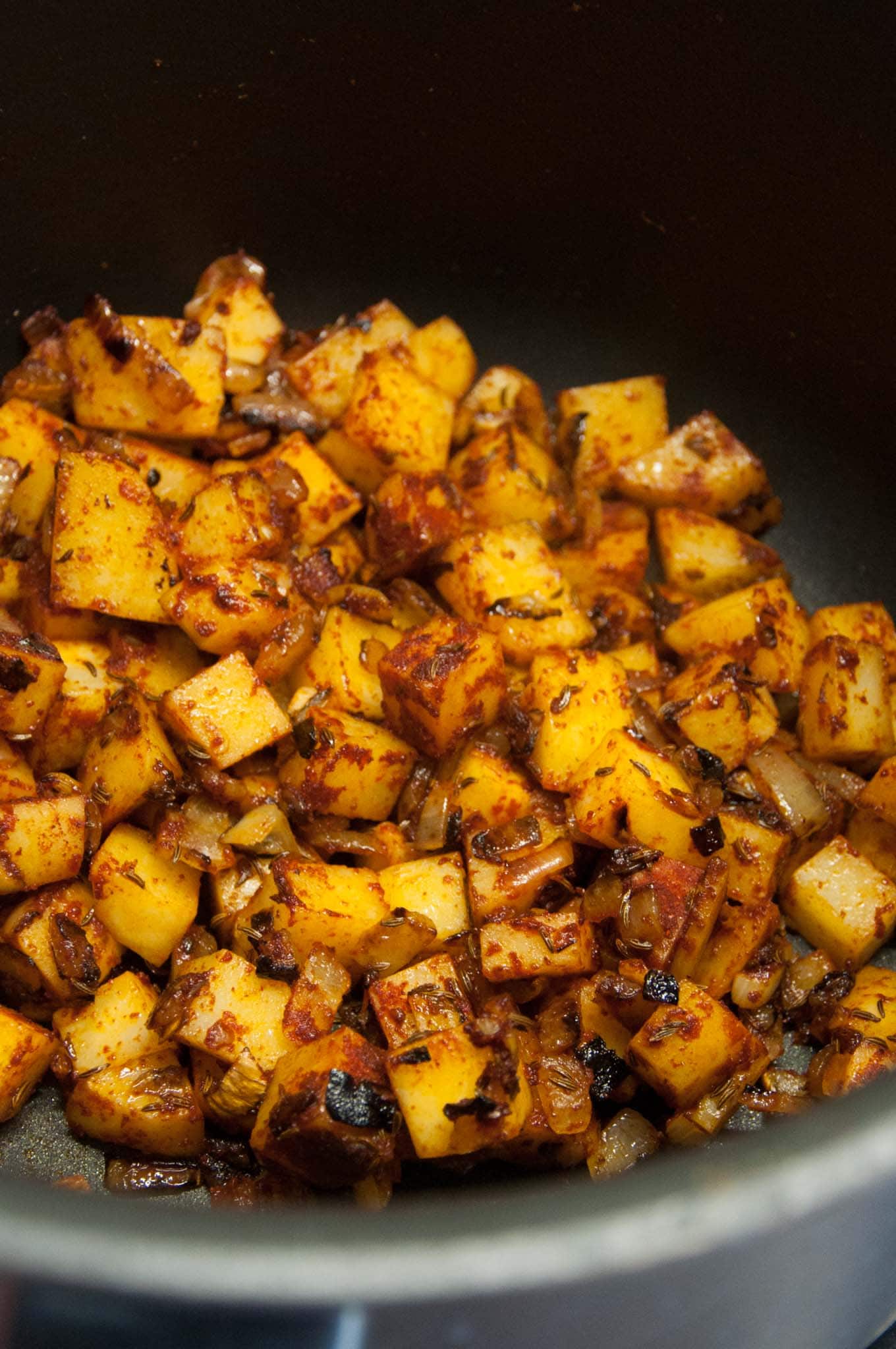 Seasoned potatoes in a pot for vegan goulash