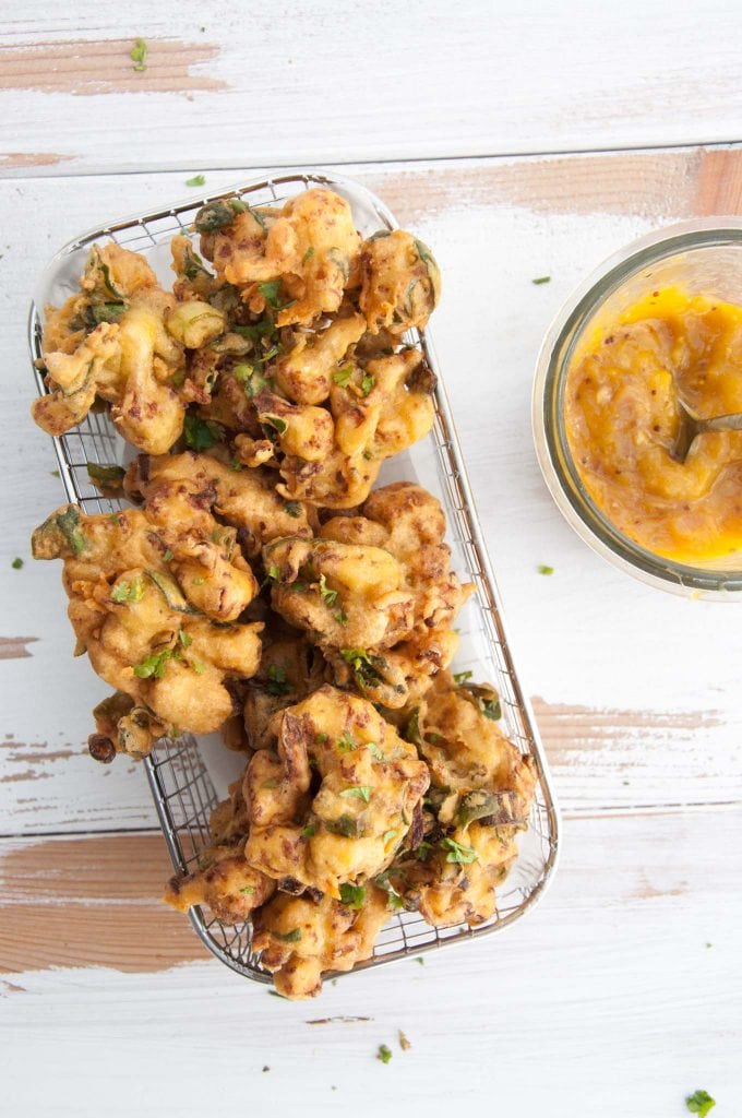 Vegetable Pakoras being served with Mango Chutney