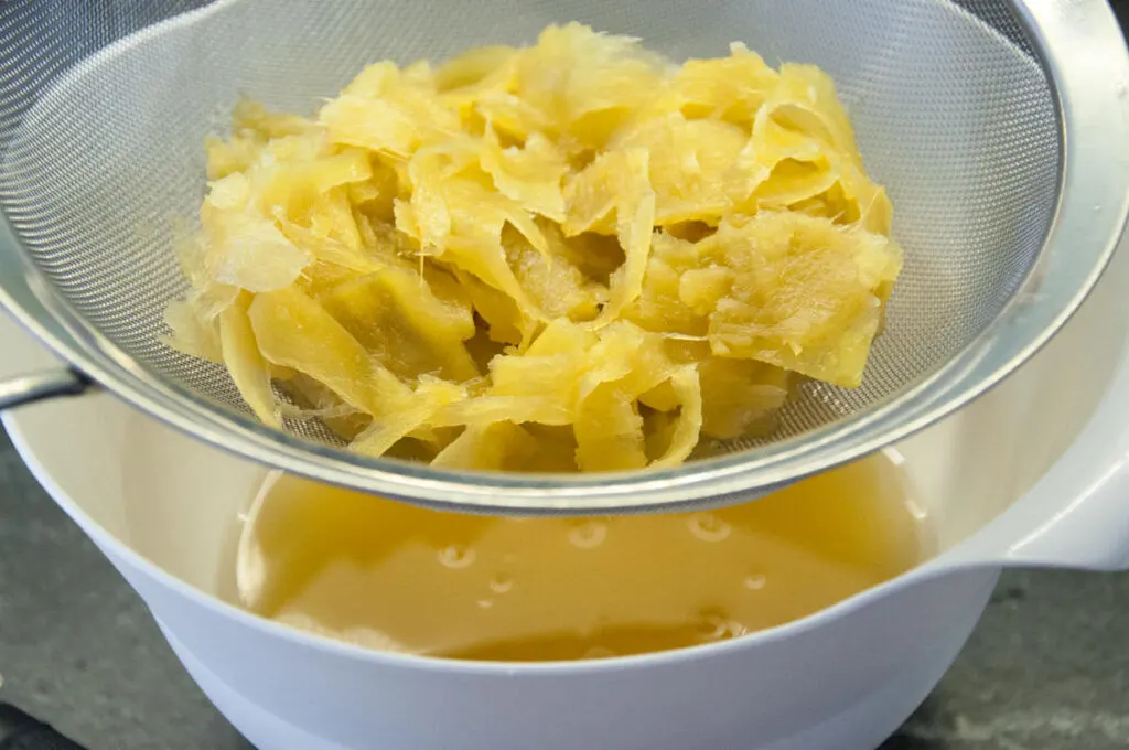 straining ginger