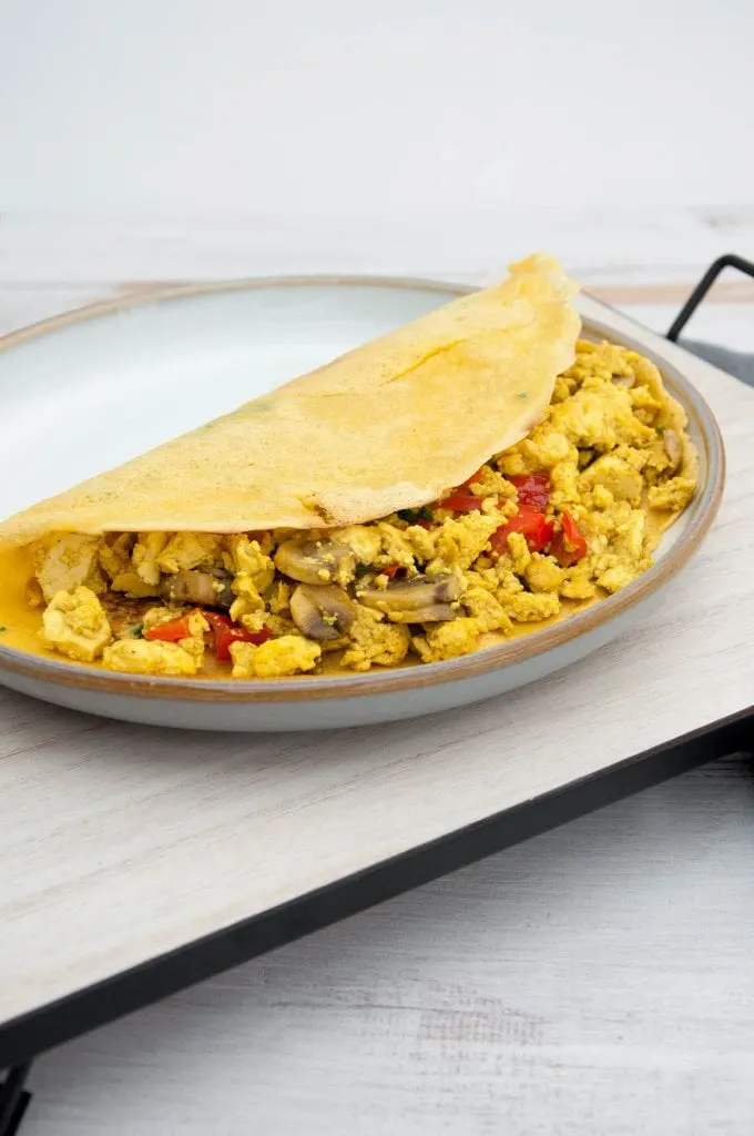 Tofu Scramble with Mushrooms and Bell Pepper in a chickpea omelet