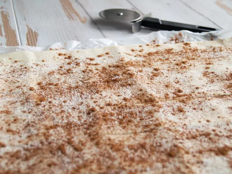 Vegan Apple Roses Puff pastry sprinkled with sugar and cinnamon