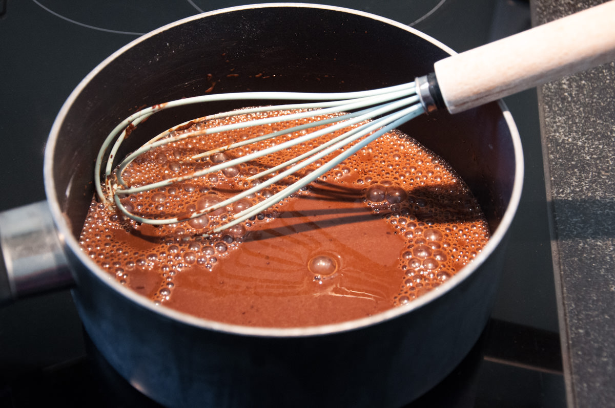 Whisking pudding mixture into bowl
