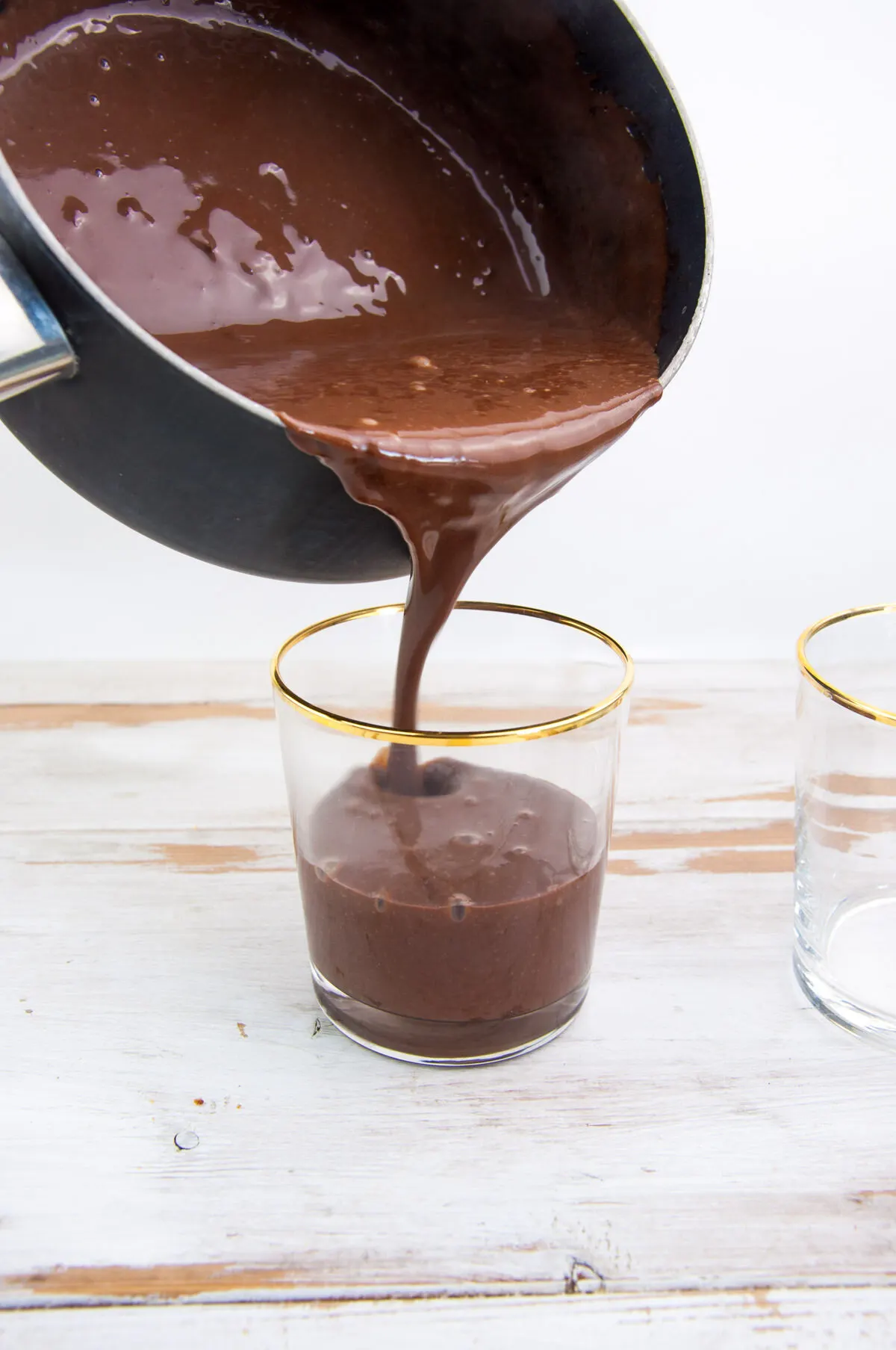 pouring the pudding into glasses