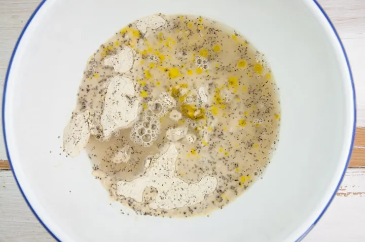 dry and wet ingredients for the poppy seed crackers in a bowl