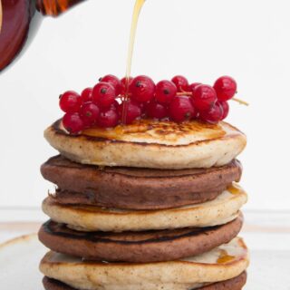 Vegan Cocoa and Vanilla Pancake Tower with maple syrup drizzling on top