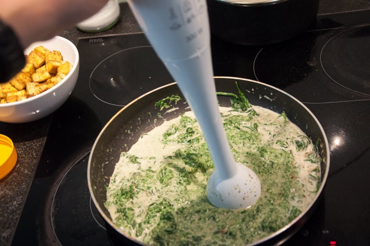 mixing spinach and coconut milk