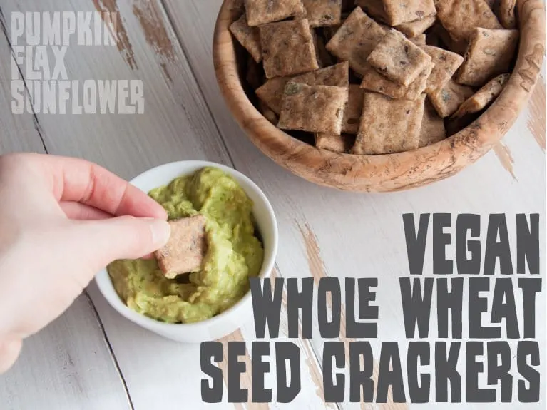 Whole Wheat Seed Crackers dipped in guacamole