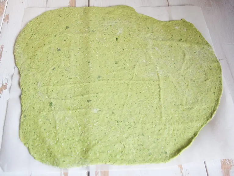 Vegan Spinach & Sesame Crackers rolled out green dough for making spinach crackers