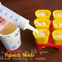 Use a syringe to fill your popsicle molds without making a mess