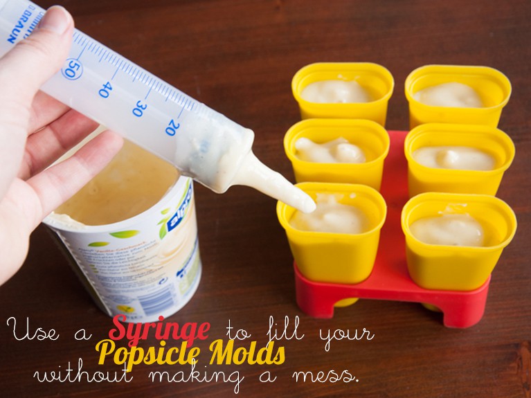 Use a syringe to fill your popsicle molds without making a mess