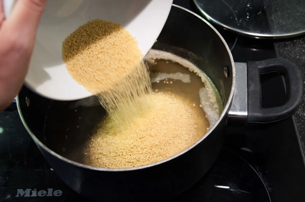 adding couscous to water