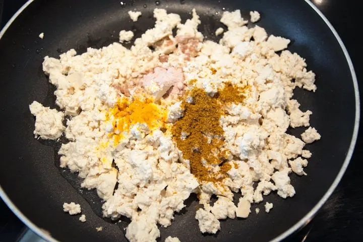 scrambled tofu and spices in a pan