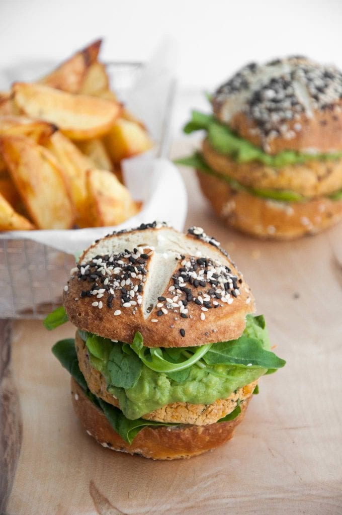 Vegan Falafel Burger with avocado sauce in pretzel buns