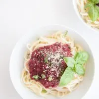 Fruity & Purple Spaghetti Bolognese topped with cashew parmesan and fresh basil