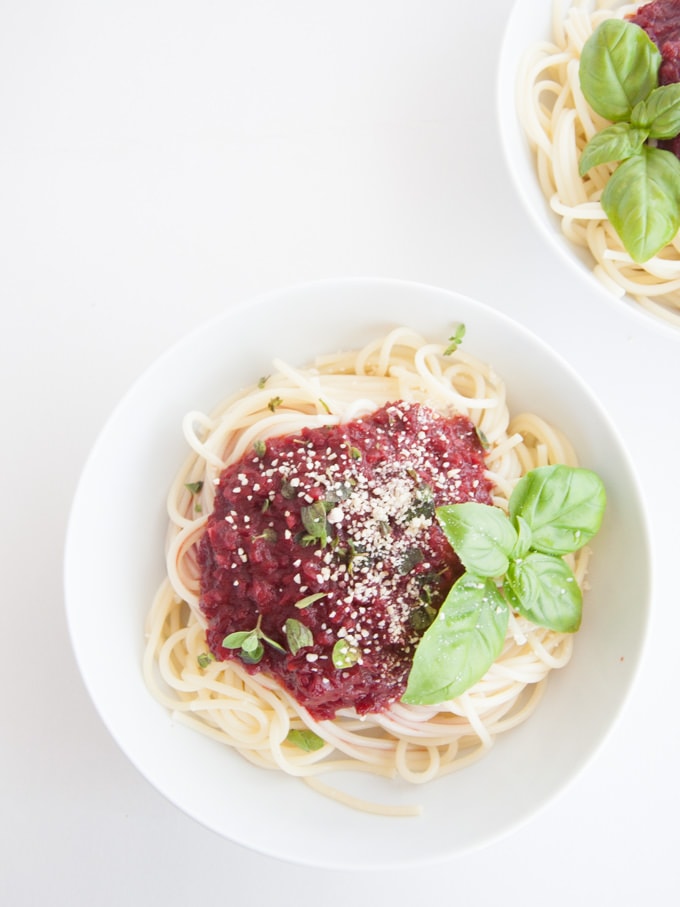 Fruity & Purple Spaghetti Bolognese topped with cashew parmesan and fresh basil