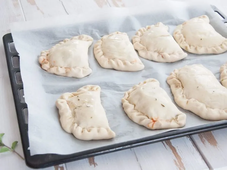 Vegan Mini Calzones on a baking tray before baking