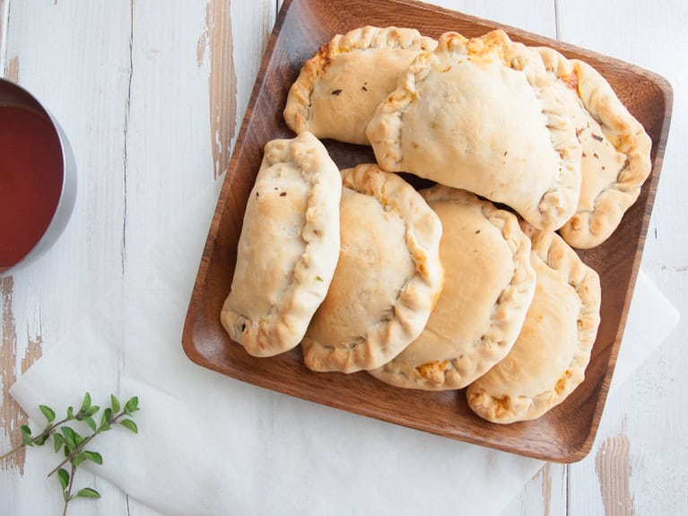 Vegan Mini Calzones on wooden plate