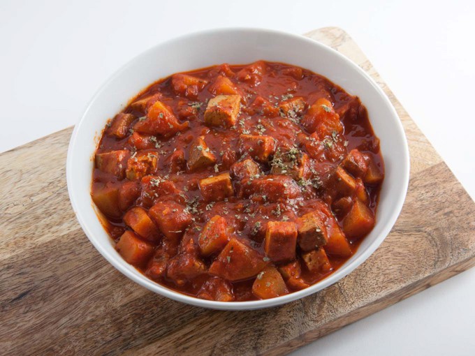 Vegan Goulash with smoked tofu and potatoes in a white bowl
