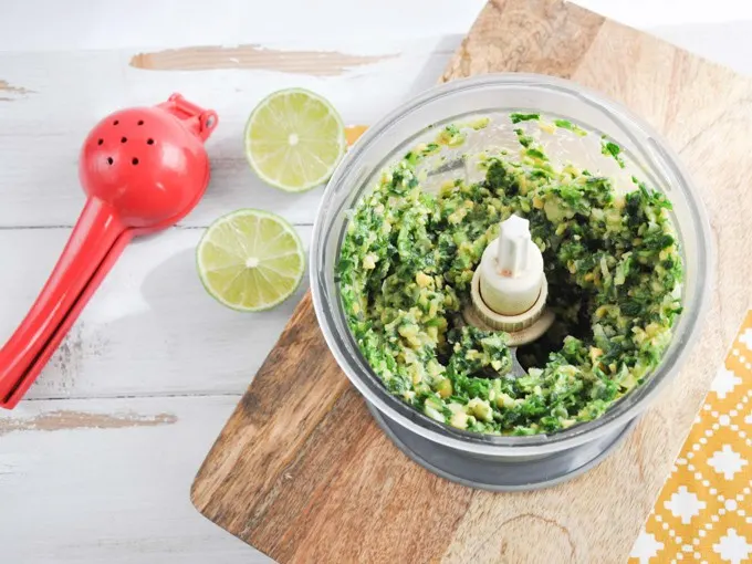 making green falafel - chickpeas and collard greens in a food processor