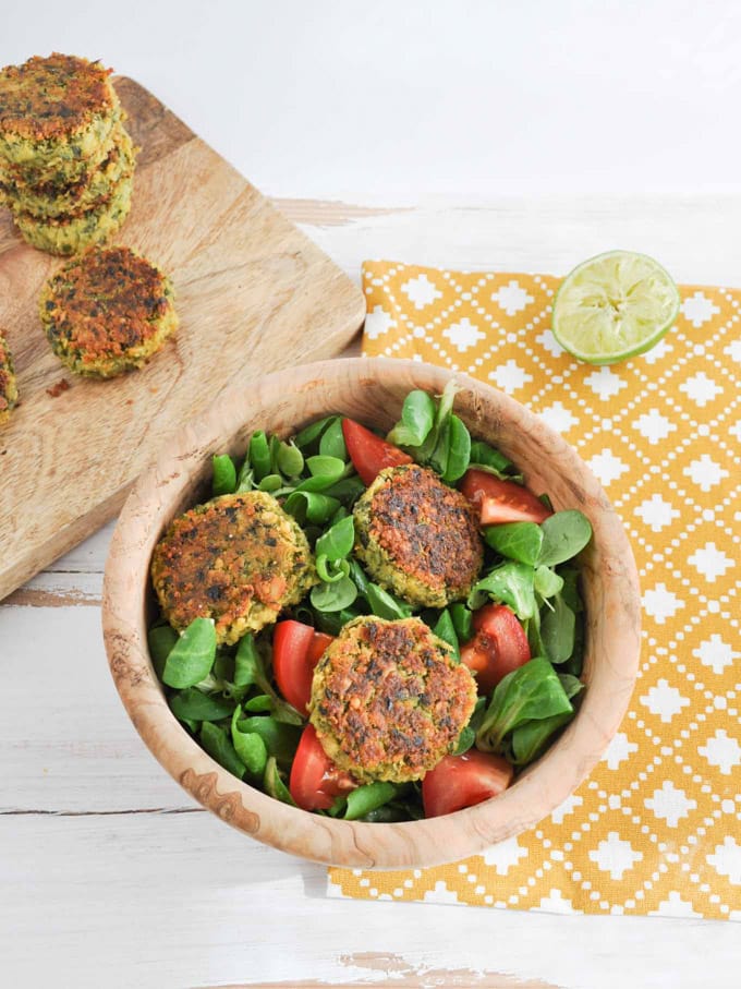 Green Falafel on a salad with tomatoes