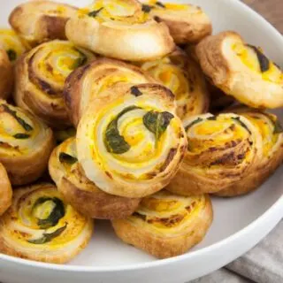 vegan pumpkin basil pinwheels on a plate