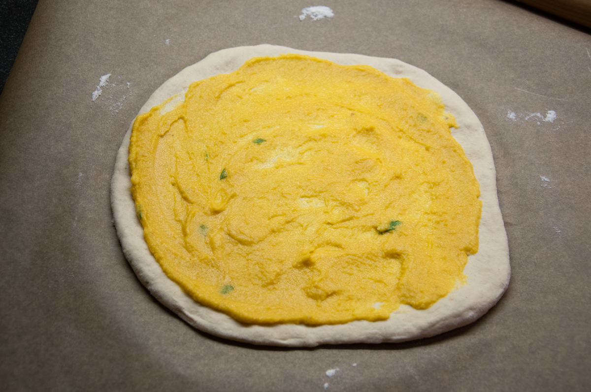 pizza dough with pumpkin sauce