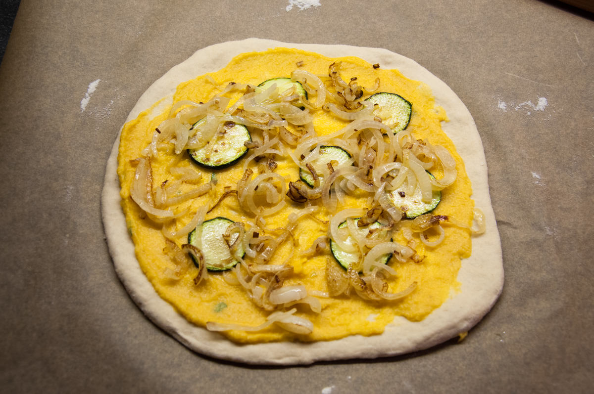 Vegan Pumpkin Pizza with caramelized onions and zucchini