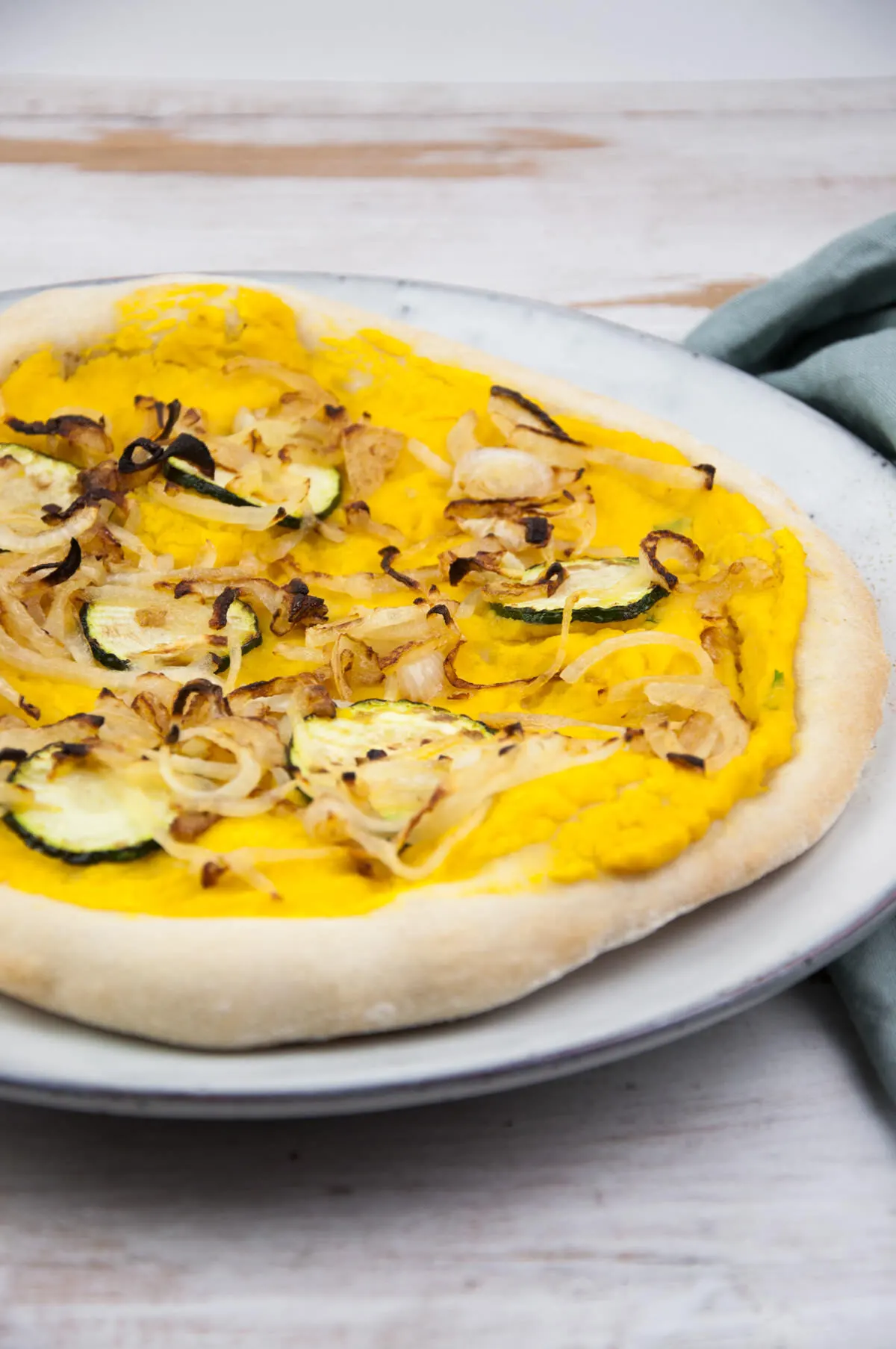 Vegan Pumpkin Pizza with caramelized onions and zucchini