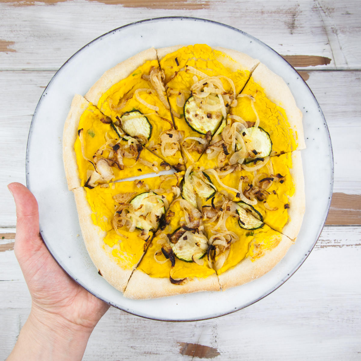 Vegan Pumpkin Pizza with caramelized onions and zucchini