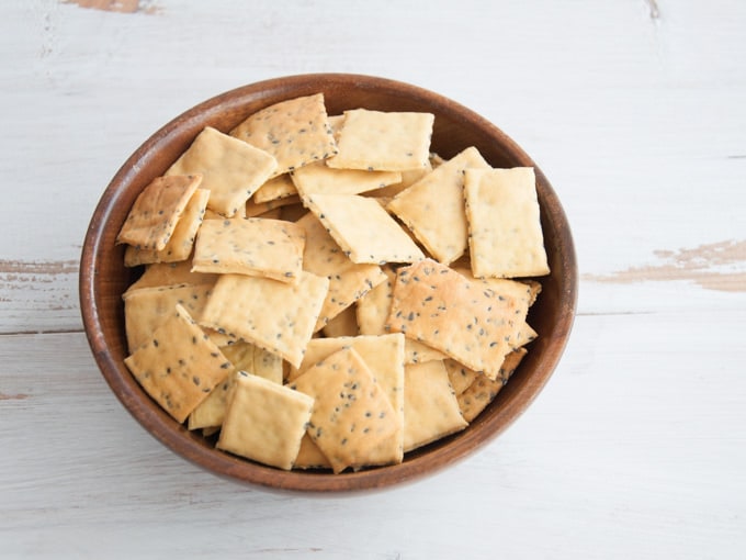 Gluten-free Vegan Chickpea Crackers in a wooden bowl