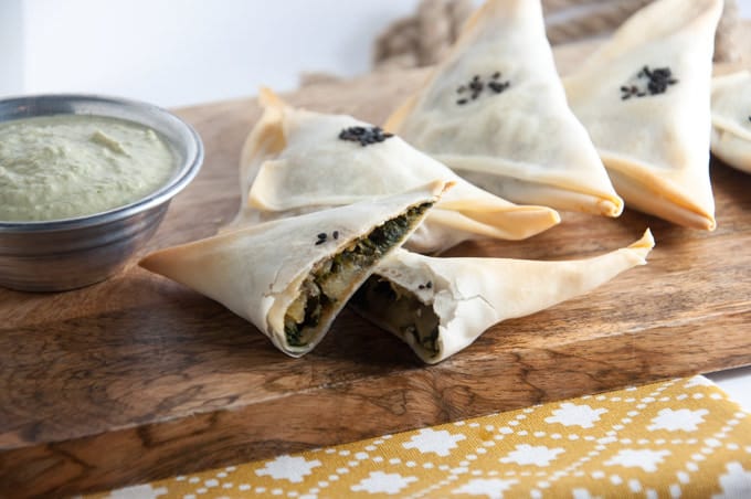 Baked Samosas filled with spinach & potatoes served with a cilantro sunflower seed sauce