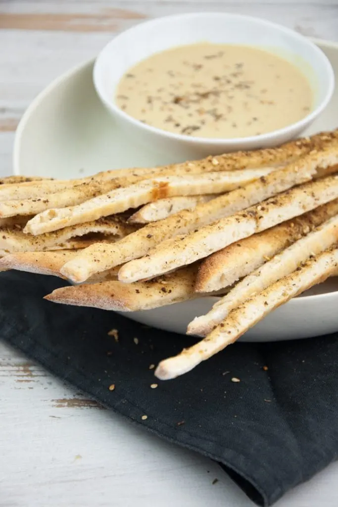 Vegan Za'atar Breadsticks served with vegan cheese sauce