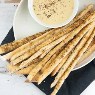 Vegan Za'atar Breadsticks served with vegan cheese sauce