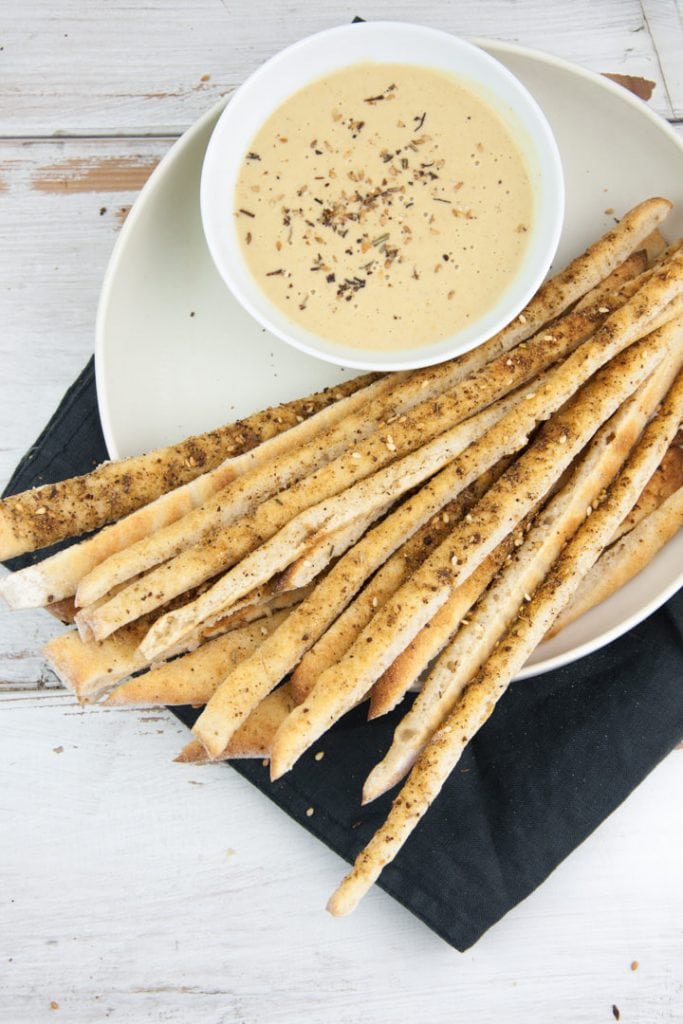 Vegan Za'atar Breadsticks served with vegan cheese sauce