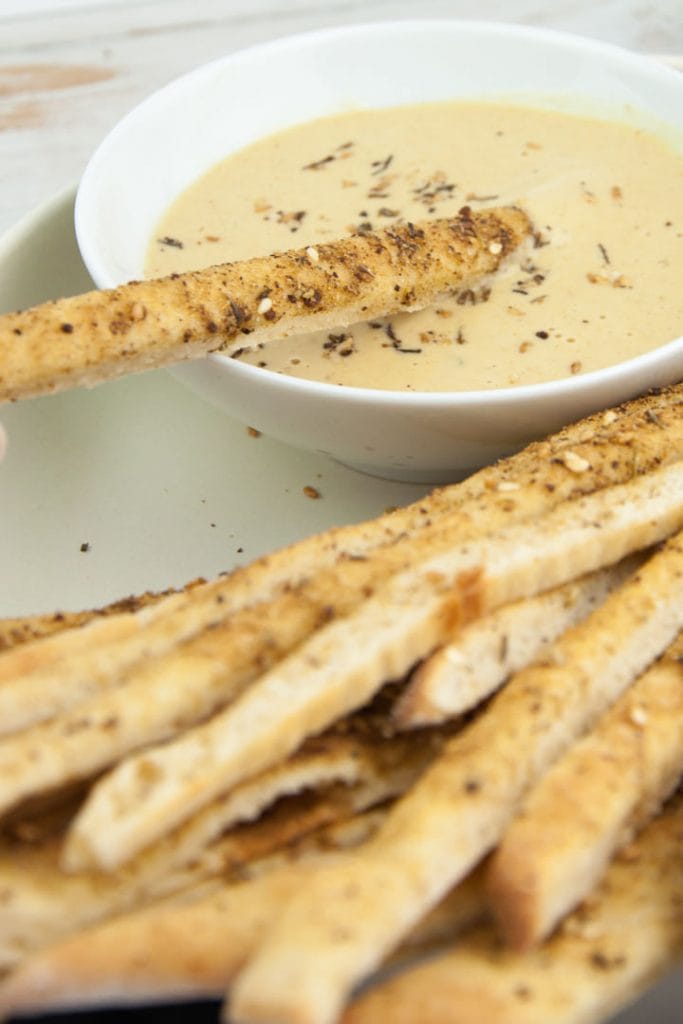 Vegan Za'atar Breadsticks served with vegan cheese sauce