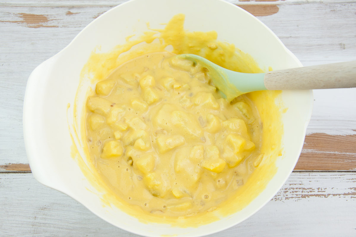 mixing the potatoes, onions, and chickpea batter