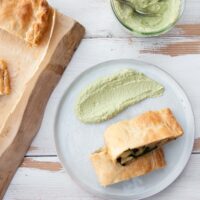 Vegan Potato and Spinach Strudel from the top served with cilantro sunflower sauce