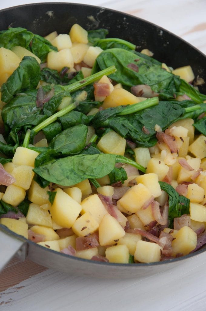 The filling for the savory strudel: potatoes, spinach and red onion