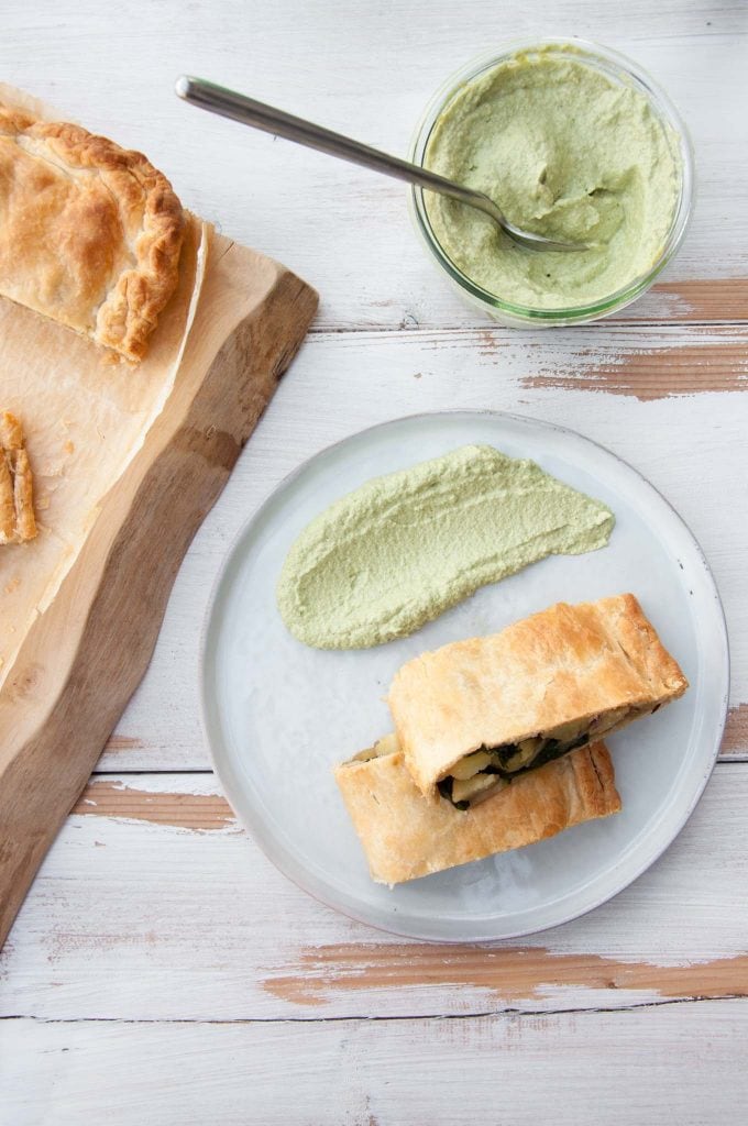 Vegan Potato and Spinach Strudel from the top served with cilantro sunflower sauce