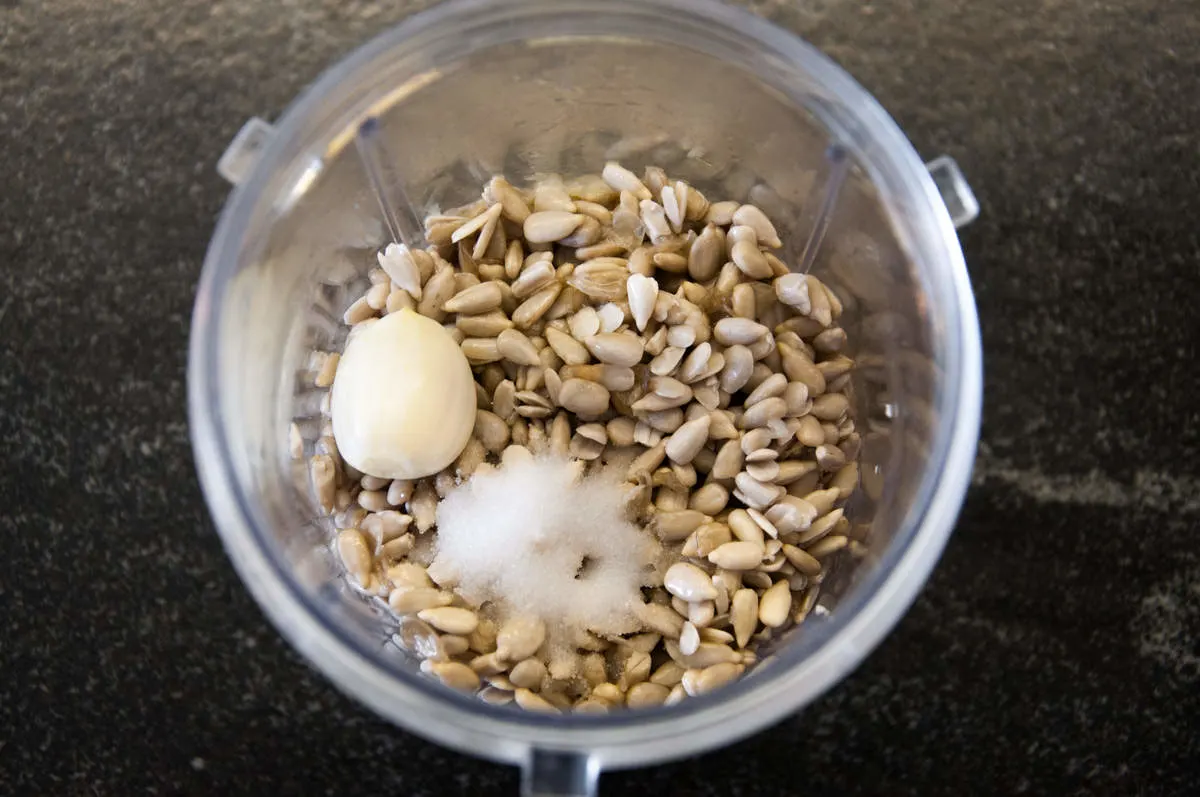 sunflower seeds, garlic, salt, water, lemon juice, maple syrup in blender