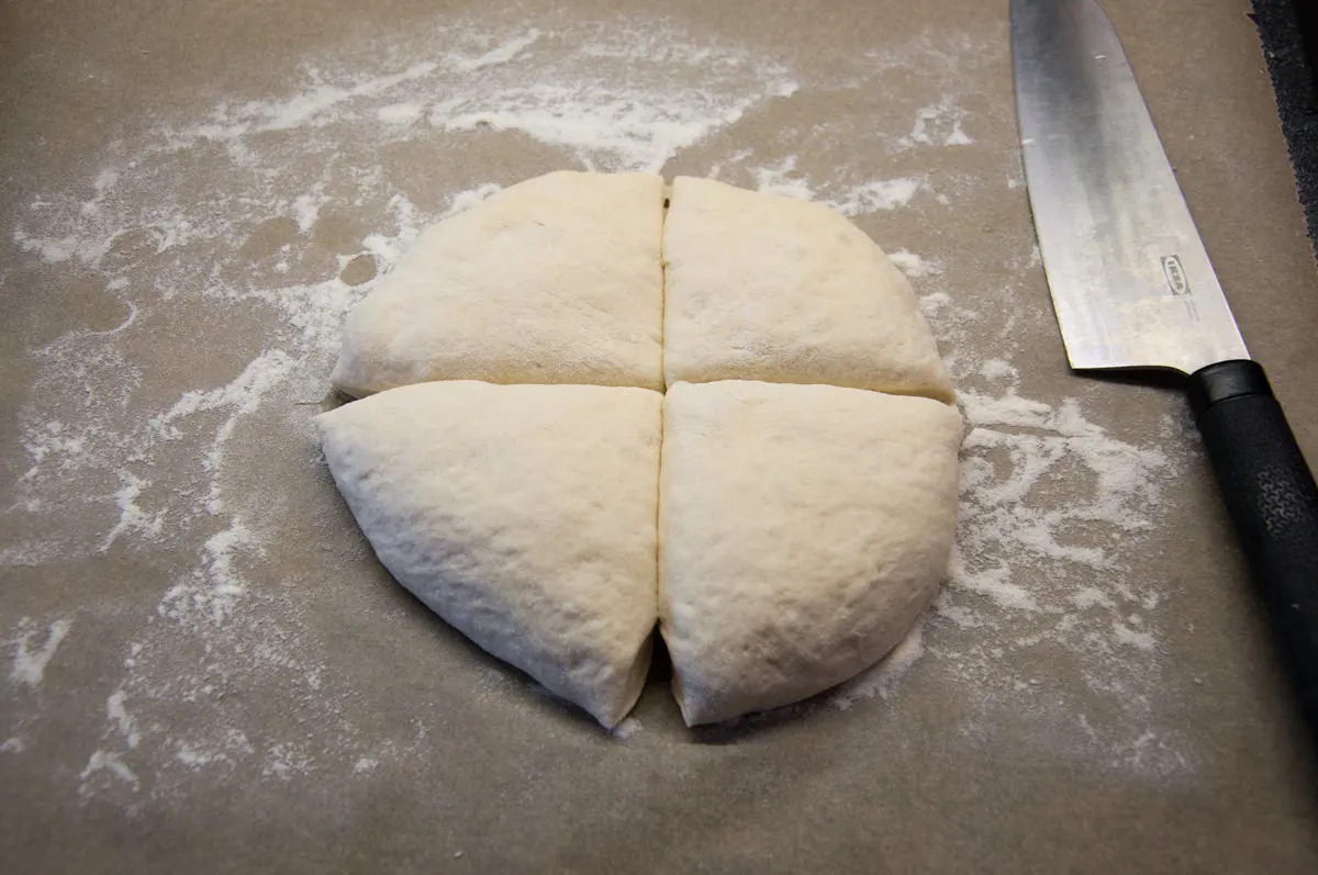 tortilla dough divided into 4 pieces