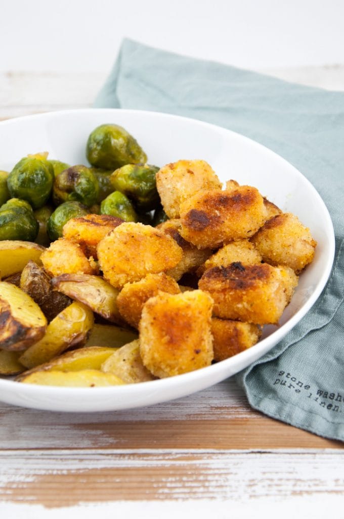 vegan pumpkin nuggets with brussels sprouts and wedges