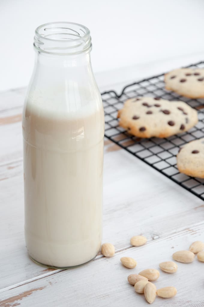 Almond Milk with cookies in the background