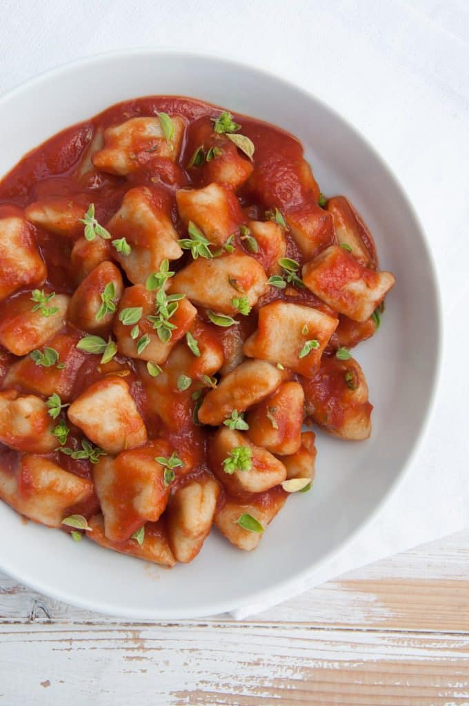 Vegan Gnocchi made from scratch in the pan topped with oregano