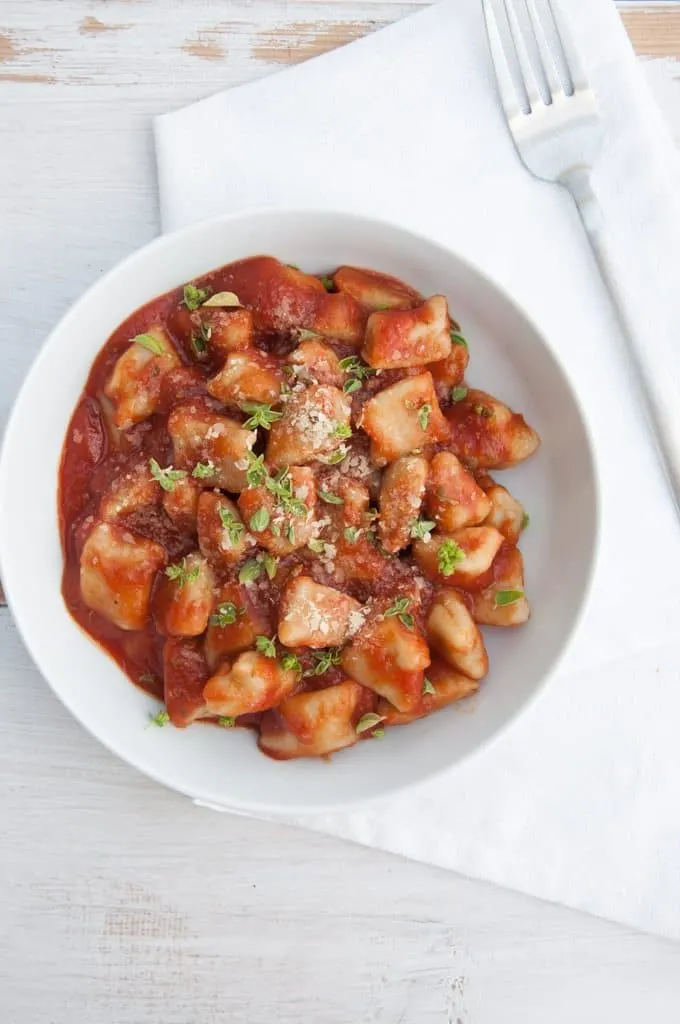 Vegan Gnocchi made from scratch in the pan topped with oregano