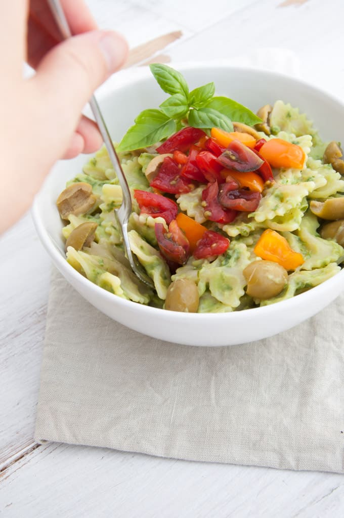 Avocado Basil Cream Sauce tossed in pasta with olives and tomatoes