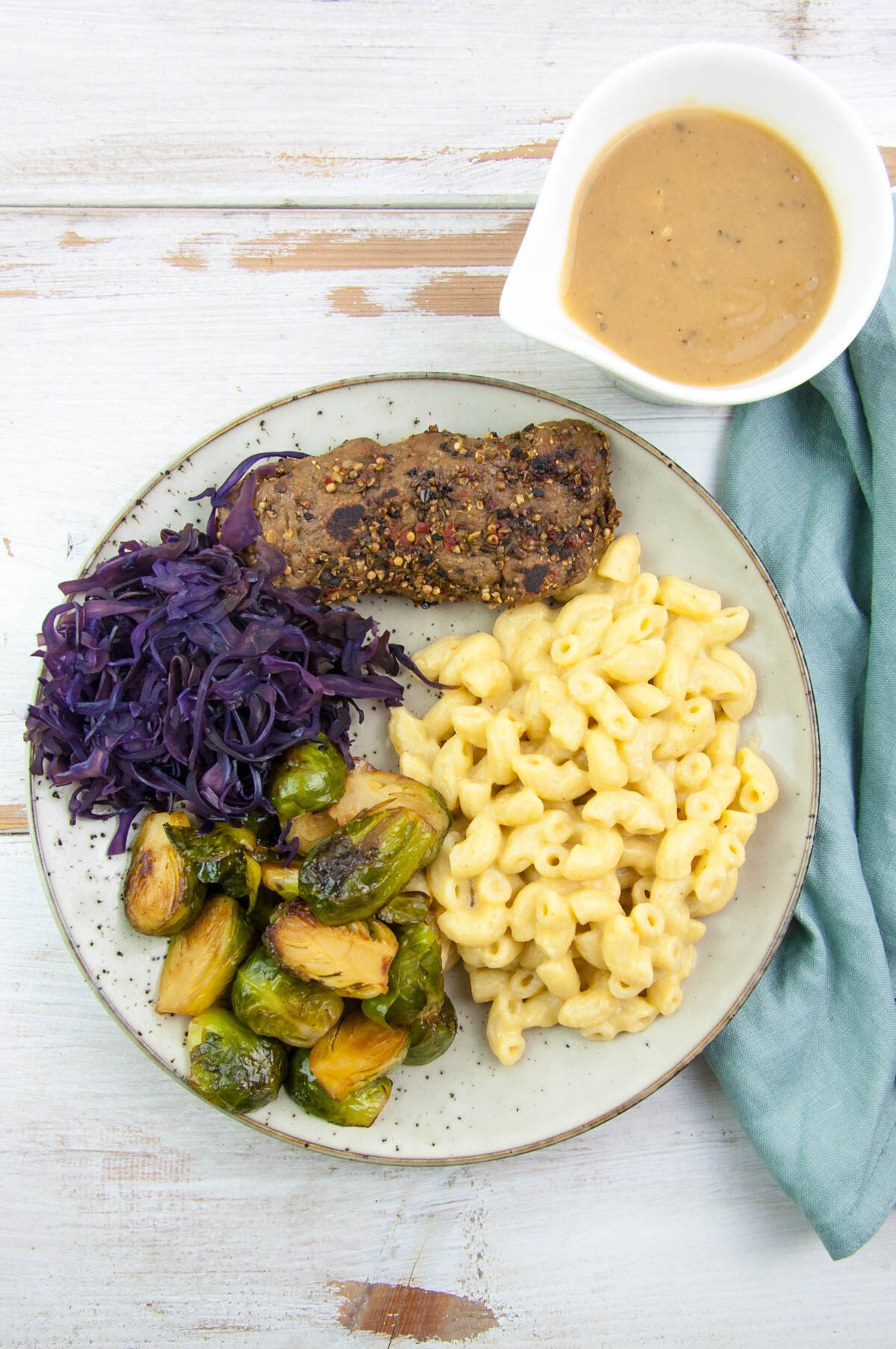 Stovetop Vegan Mac and Cheese with Steak, Brussels sprouts, red cabbage, peppercorn sauce