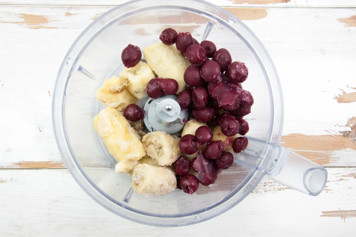 frozen bananas and sour cherries in food processor
